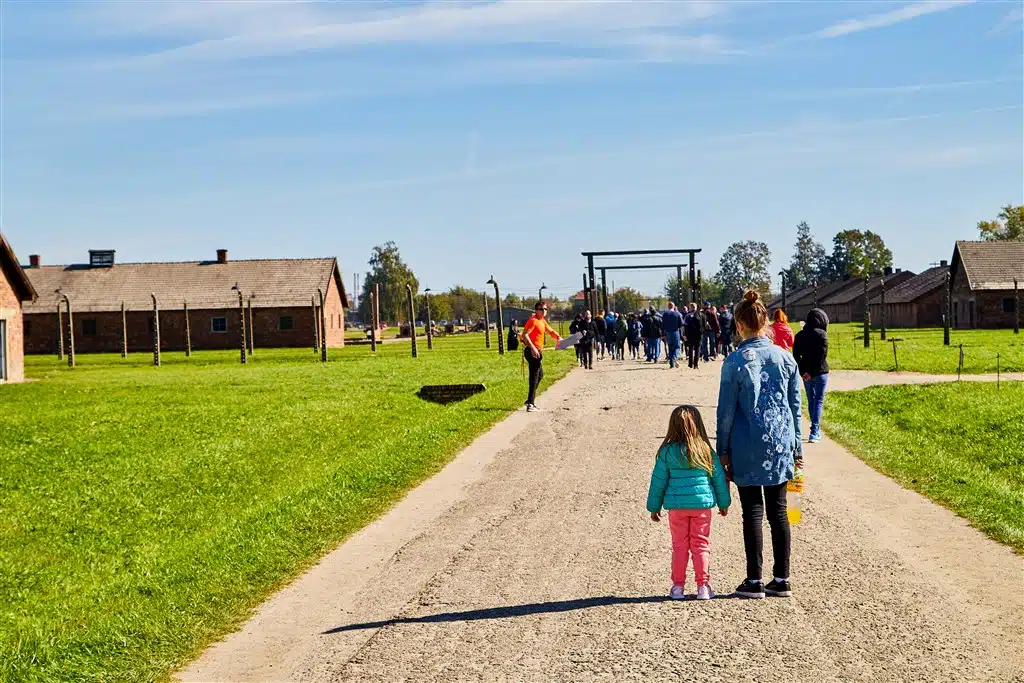 Tourists visiting Auschwitz Birkenau tourist route