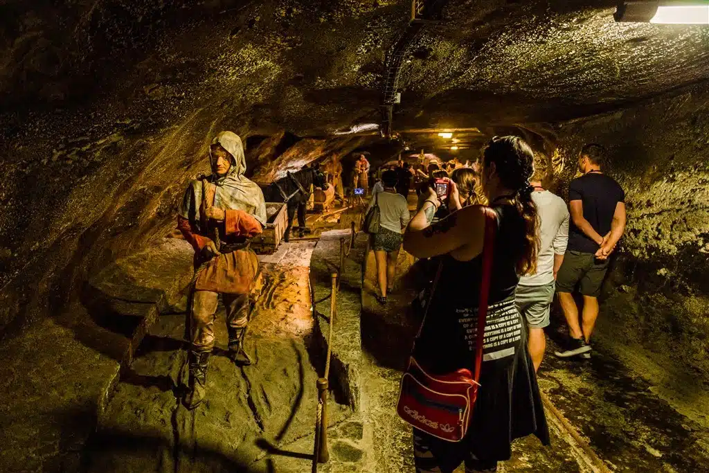 Wieliczka corridor with miners and tourists