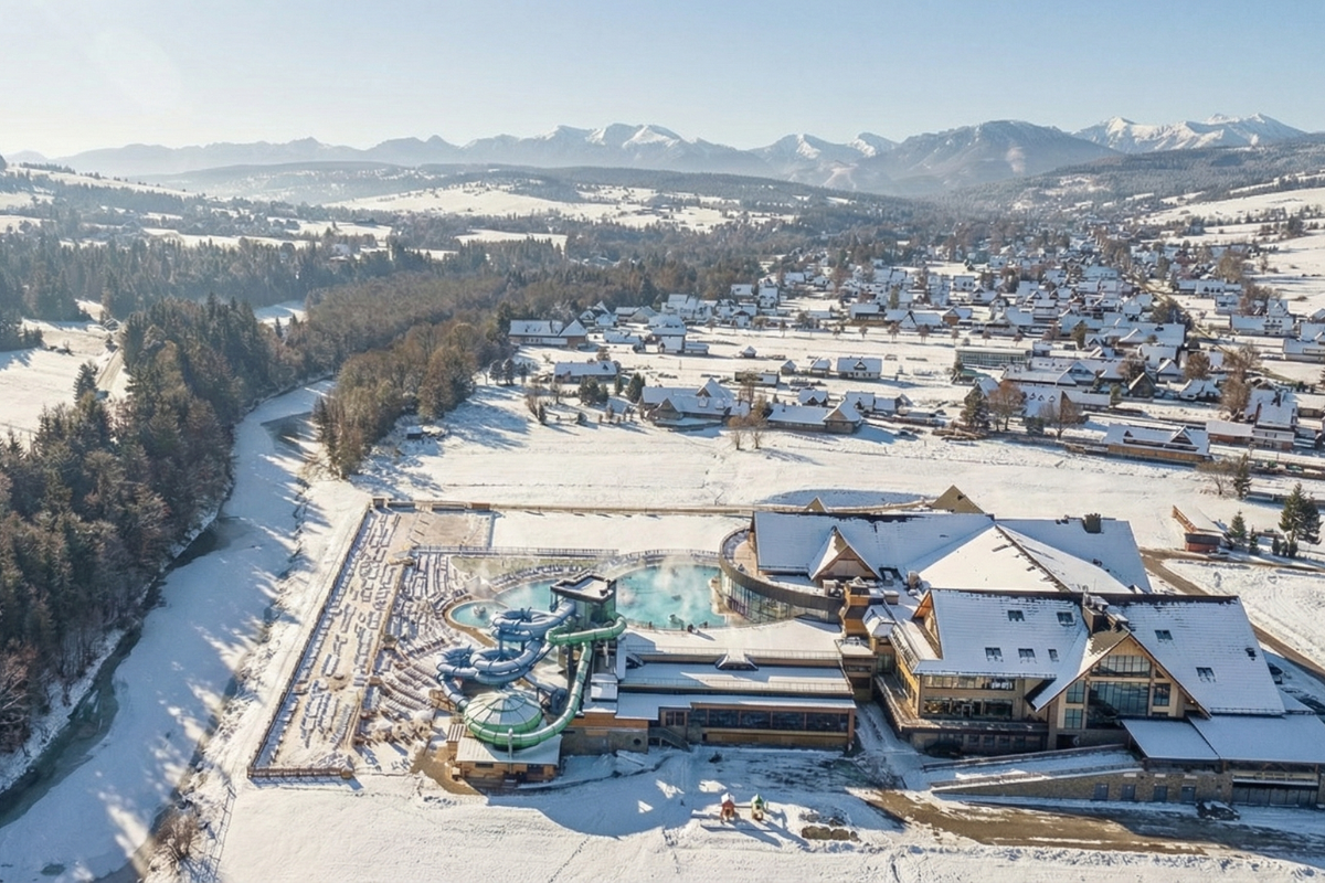 Thermal Baths Complex Surrounded by Snowy Landscape Chochołowskie Termy Zakopane thermal baths complex in snowy winter landscape