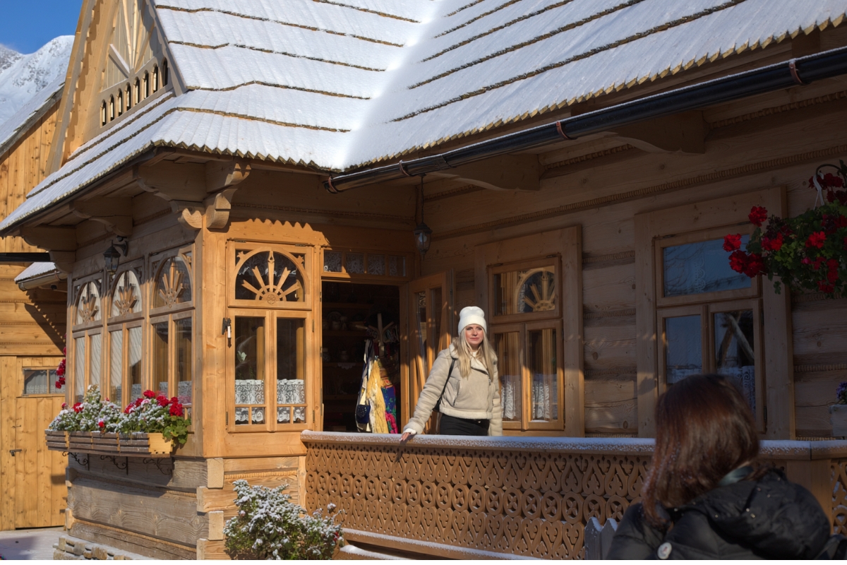 zakopane-wooden-house-balcony Woman standing on a balcony of a wooden house in Zakopane